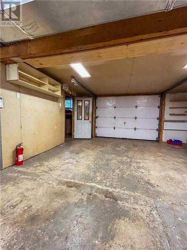 213 Des Pionniers, Balmoral, NB - Indoor Photo Showing Garage