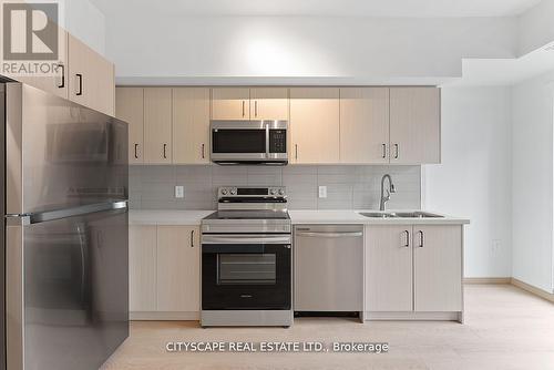 C2-307 - 3423 Sheppard Avenue E, Toronto, ON - Indoor Photo Showing Kitchen With Double Sink