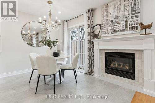 41 Katrina Court, Toronto, ON - Indoor Photo Showing Dining Room With Fireplace