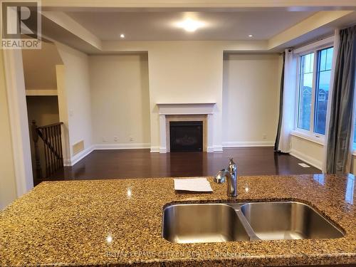 211 Symington Avenue, Oshawa, ON - Indoor Photo Showing Kitchen With Fireplace With Double Sink