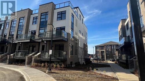 121 - 1569 Rose Way, Milton, ON - Outdoor With Balcony With Facade