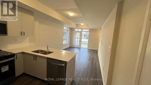 121 - 1569 Rose Way, Milton, ON - Indoor Photo Showing Kitchen With Double Sink