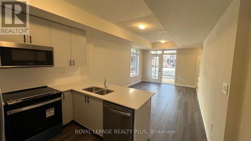 121 - 1569 Rose Way, Milton, ON - Indoor Photo Showing Kitchen With Double Sink