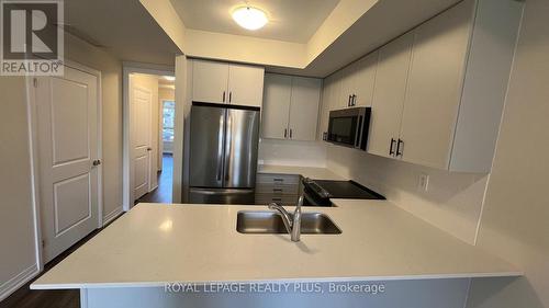 121 - 1569 Rose Way, Milton, ON - Indoor Photo Showing Kitchen With Double Sink