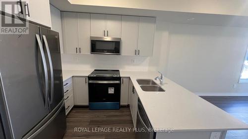 121 - 1569 Rose Way, Milton, ON - Indoor Photo Showing Kitchen With Stainless Steel Kitchen With Double Sink