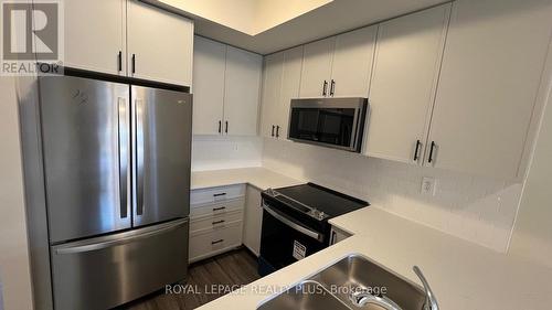 121 - 1569 Rose Way, Milton, ON - Indoor Photo Showing Kitchen With Stainless Steel Kitchen With Double Sink