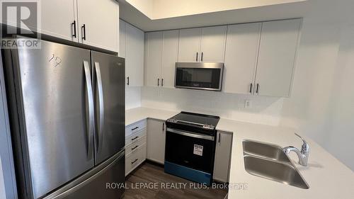 121 - 1569 Rose Way, Milton, ON - Indoor Photo Showing Kitchen With Stainless Steel Kitchen With Double Sink