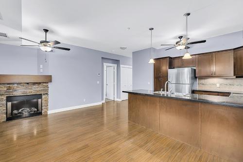 307-3533 Carrington Road, West Kelowna, BC - Indoor Photo Showing Kitchen With Fireplace