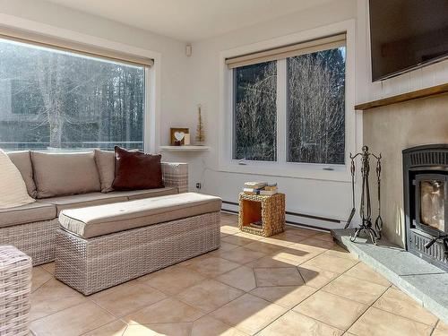 Living room - 400 Ch. Élie, Sutton, QC - Indoor With Fireplace