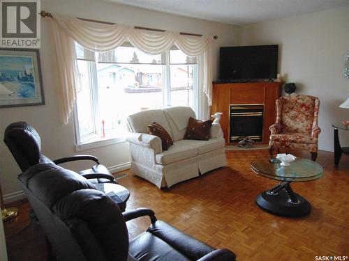 209 1St Avenue N, Martensville, SK - Indoor Photo Showing Living Room With Fireplace