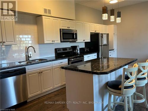 513 - 198 Scott Street, St. Catharines, ON - Indoor Photo Showing Kitchen With Double Sink