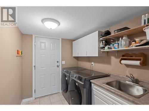 Laundry room located in the basement - 1650 Wilmot Court, Kelowna, BC - Indoor Photo Showing Laundry Room