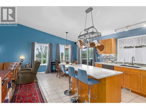 Open plan kitchen leading into the dining area. - 1650 Wilmot Court, Kelowna, BC - Indoor