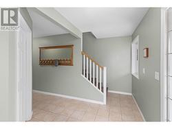 Spacious entrance hall leading to upstairs living area. - 