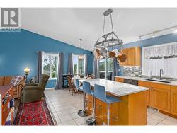 Open plan kitchen leading into the dining area. - 