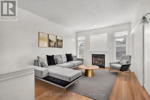 Virtually Staged living room - 17 - 578 Mcgarrell Place, London, ON - Indoor Photo Showing Living Room With Fireplace