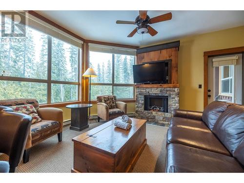 4559 Timberline Crescent Unit# 632A, Fernie, BC - Indoor Photo Showing Living Room With Fireplace