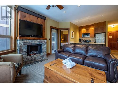 4559 Timberline Crescent Unit# 632A, Fernie, BC - Indoor Photo Showing Living Room With Fireplace