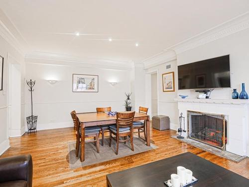 Dining room - B54-3940 Ch. De La Côte-Des-Neiges, Montréal (Ville-Marie), QC - Indoor Photo Showing Living Room With Fireplace