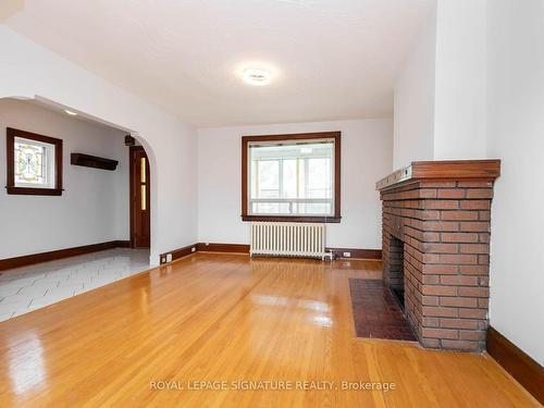 214 Mortimer Ave, Toronto, ON - Indoor Photo Showing Other Room With Fireplace