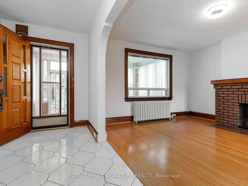 214 Mortimer Ave, Toronto, ON - Indoor Photo Showing Other Room With Fireplace