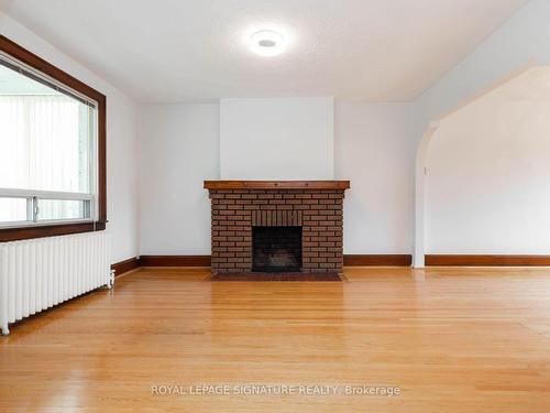 214 Mortimer Ave, Toronto, ON - Indoor Photo Showing Living Room With Fireplace