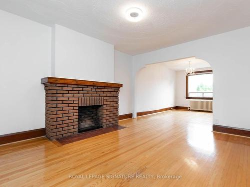 214 Mortimer Ave, Toronto, ON - Indoor Photo Showing Living Room With Fireplace