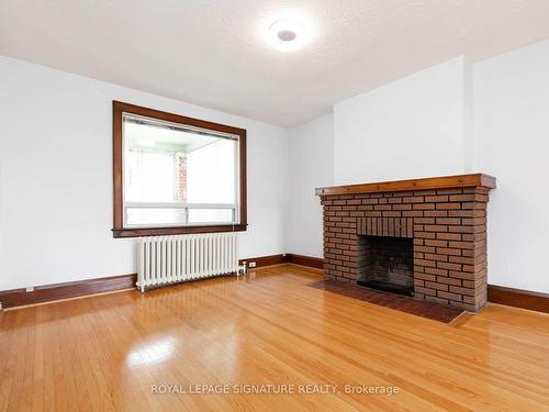 214 Mortimer Ave, Toronto, ON - Indoor Photo Showing Living Room With Fireplace