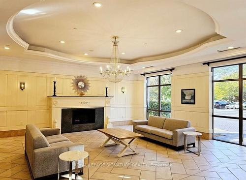 416-700 Humberwood Blvd, Toronto, ON - Indoor Photo Showing Living Room With Fireplace