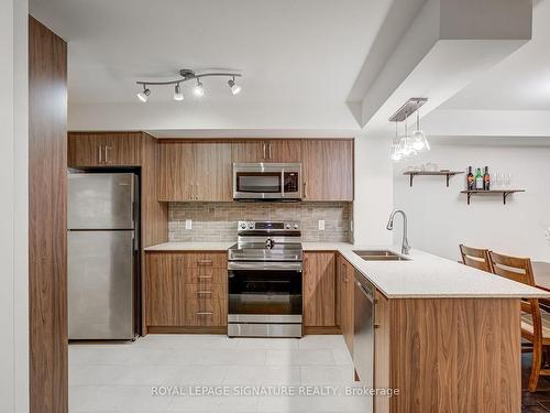 407-4080 Living Arts Dr, Mississauga, ON - Indoor Photo Showing Kitchen With Stainless Steel Kitchen With Double Sink With Upgraded Kitchen