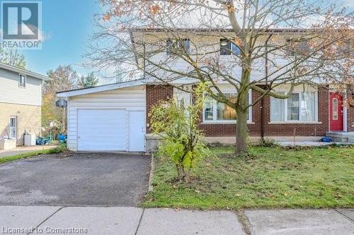 View of front of home featuring a garage - 175 Cedarbrae Avenue, Waterloo, ON - Outdoor