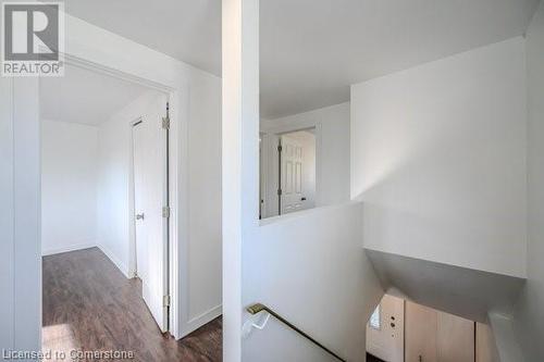 Corridor with dark wood-type flooring - 175 Cedarbrae Avenue, Waterloo, ON - Indoor Photo Showing Other Room