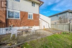 Rear view of house featuring a patio area - 