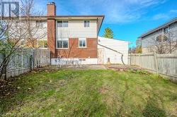 Back of house featuring a patio and a lawn - 