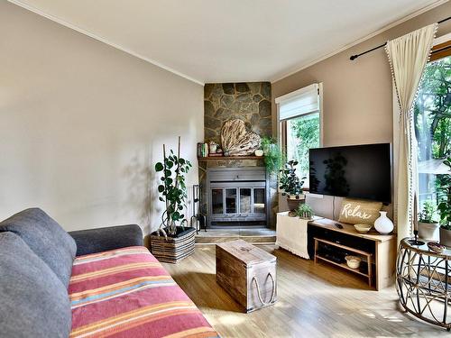 Salon - 1070Z Rue Hélène-Boullé, Boucherville, QC - Indoor Photo Showing Living Room With Fireplace