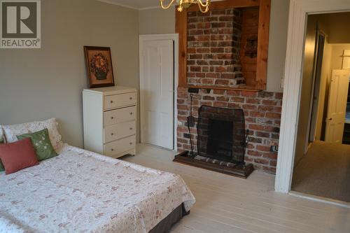 90 Queens Road, St. John'S, NL - Indoor Photo Showing Bedroom With Fireplace