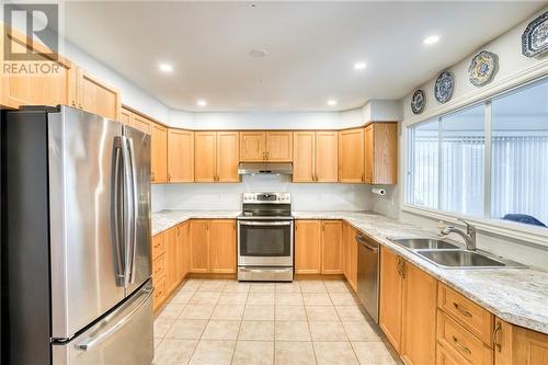 Excellent storage + cupboard space ... - 51 Decaria Boulevard, Perth, ON - Indoor Photo Showing Kitchen With Double Sink