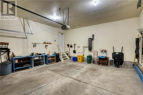 Double attached garage w/door to foyer ... - 51 Decaria Boulevard, Perth, ON - Indoor Photo Showing Garage