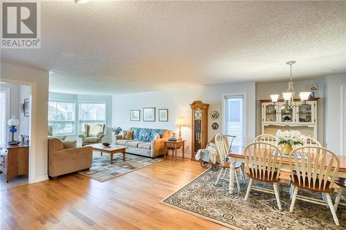 View of foyer, living + dining areas ... - 51 Decaria Boulevard, Perth, ON - Indoor Photo Showing Living Room