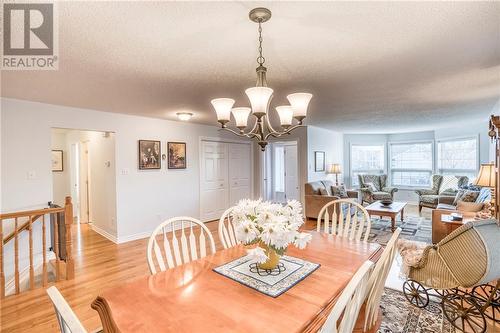 Dining view to foyer + living room ... - 51 Decaria Boulevard, Perth, ON - Indoor Photo Showing Dining Room