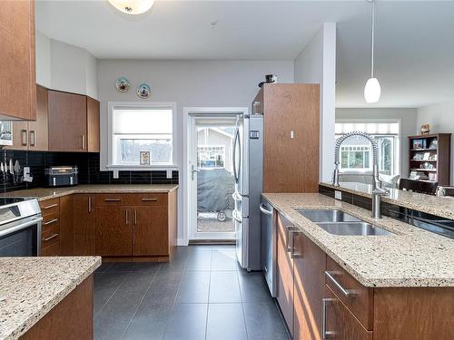 301-590 Bezanton Way, Colwood, BC - Indoor Photo Showing Kitchen With Double Sink