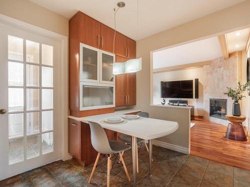 Coin-repas - 3045 Rue Michaud, Brossard, QC - Indoor Photo Showing Dining Room With Fireplace