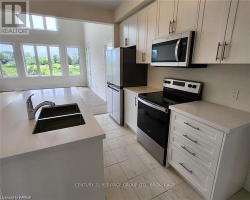 12 Oakmont Drive, Loyalist (Bath), ON - Indoor Photo Showing Kitchen With Double Sink