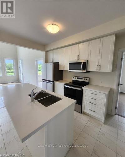 12 Oakmont Drive, Loyalist (Bath), ON - Indoor Photo Showing Kitchen With Double Sink