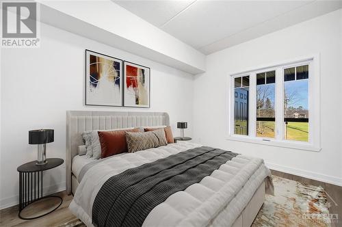 Virtually Staged - 320 Montee Outaouais Street Unit#306, Rockland, ON - Indoor Photo Showing Bedroom