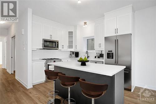 Virtually Staged - 320 Montee Outaouais Street Unit#301, Rockland, ON - Indoor Photo Showing Kitchen