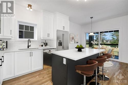 Virtually Staged - 320 Montee Outaouais Street Unit#301, Rockland, ON - Indoor Photo Showing Kitchen With Upgraded Kitchen