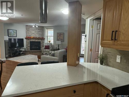 9 600 Broadway Street W, Fort Qu'Appelle, SK - Indoor Photo Showing Living Room With Fireplace