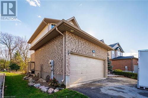 View of property exterior with a garage - 613 Black Street, Fergus, ON - Outdoor With Exterior