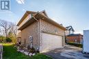 View of property exterior with a garage - 613 Black Street, Fergus, ON  - Outdoor With Exterior 